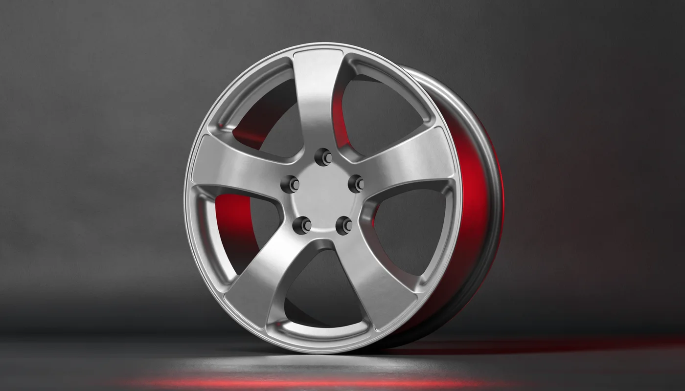 Silver five-spoke alloy wheel with a satin finish